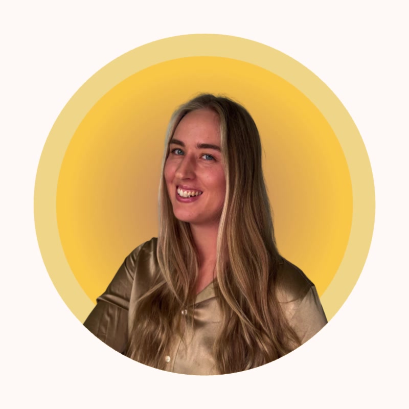 Anna Katharina smiling against a yellow circular background